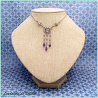 Collier Énide, fleurs argentées et cascade de cristal violet